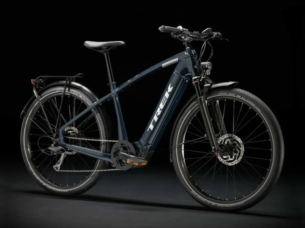 A sleek, dark blue electric bike with a powerful motor and integrated lights.