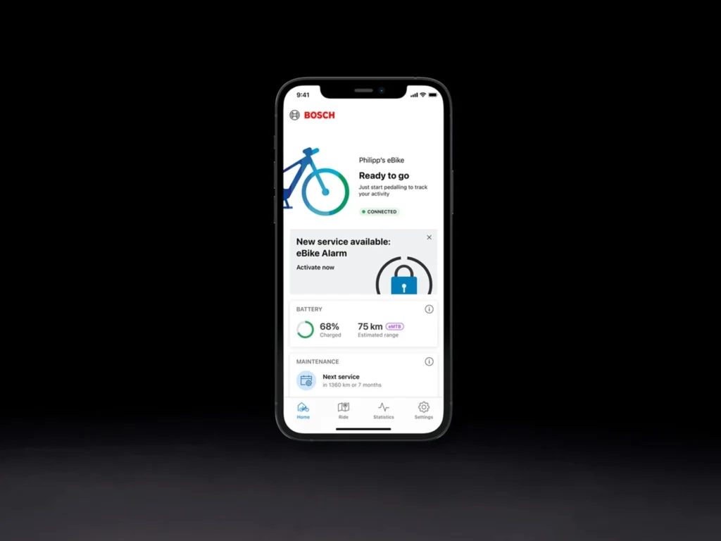 The Bosch eBike Flow app interface displays essential e-bike information, including battery status, estimated range, and maintenance reminders