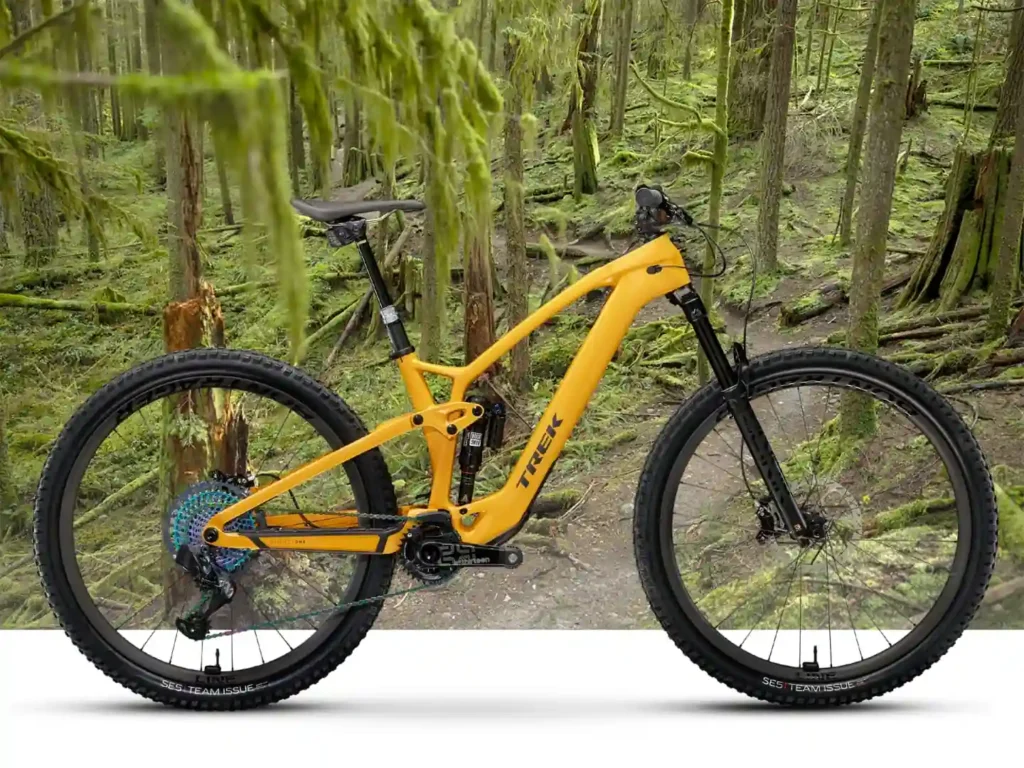 yellow Trek electric mountain bike with full suspension and wide tires