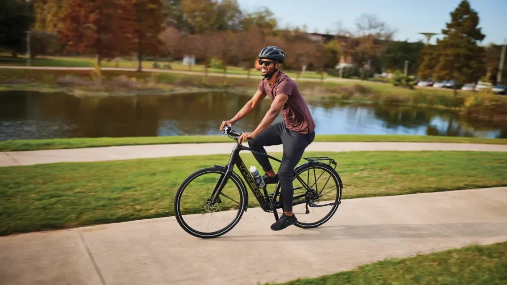 A cyclist enjoys a scenic ride on a black bike