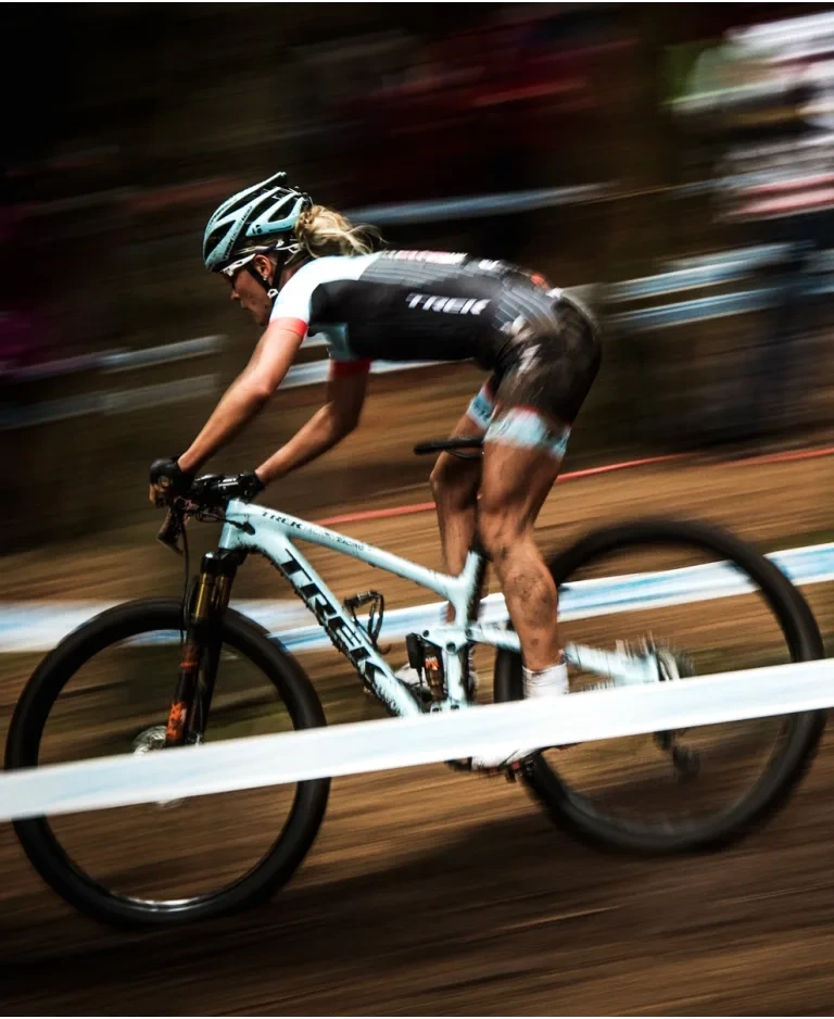 Emily Batty riding a Trek Top Fuel mountain bike.