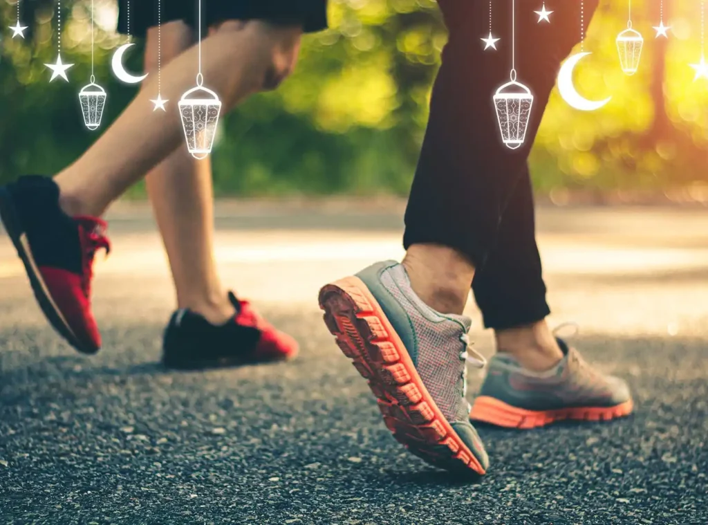 Two people are walking side-by-side on a paved path