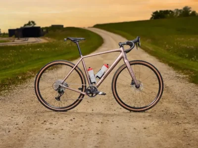 Road bike on a dirt path, modern lightweight design, ready for long, comfortable riding adventures